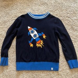 Sovereign Code 1917 boys sweater with rocket ship.